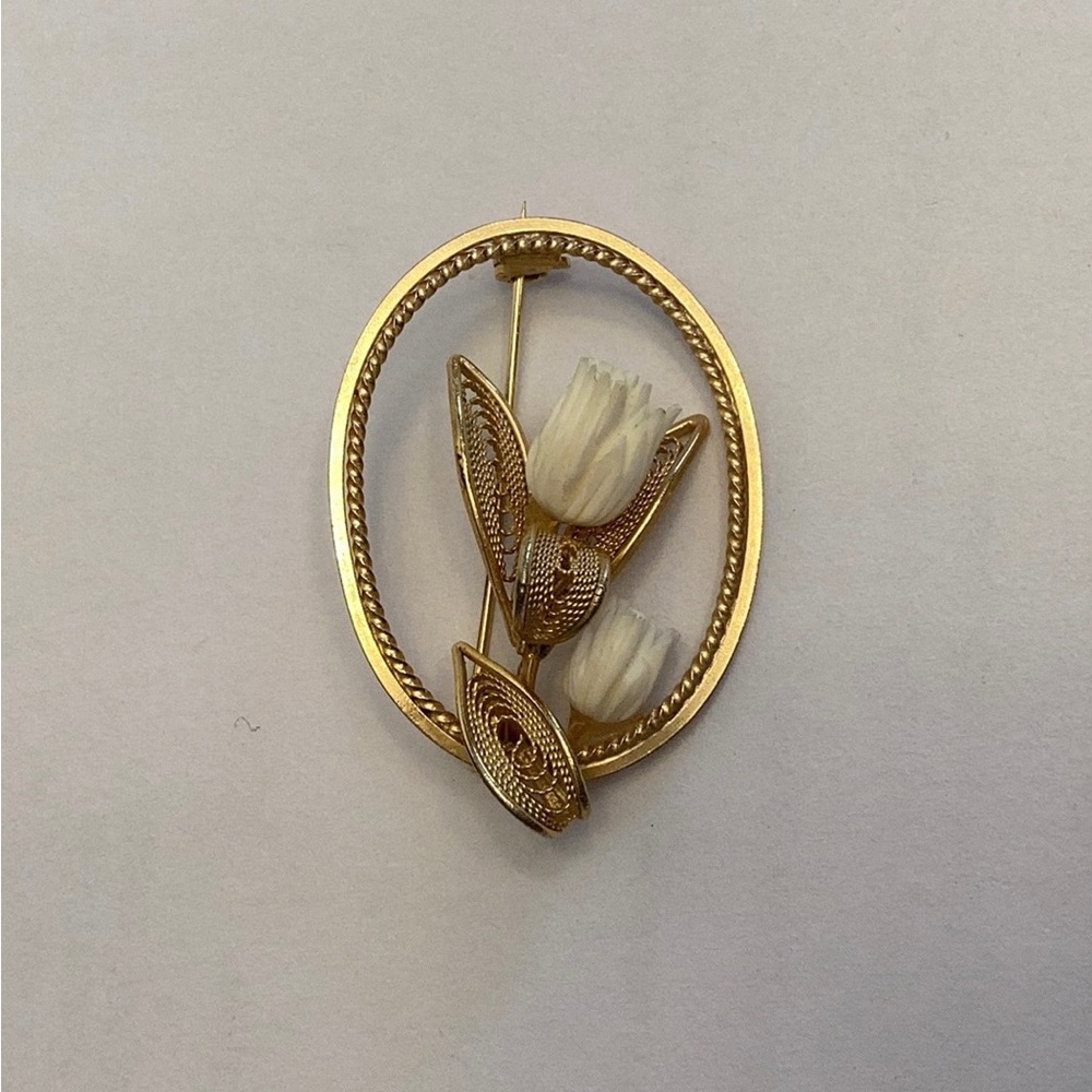 Vintage goldstone filigree and white resin floral pin. Dainty and delicate.